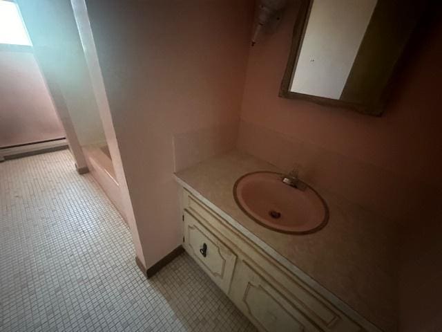 112 Minton St, Joliet, IL 60436 - bathroom with baseboard heating, vanity, tile patterned floors, and a shower