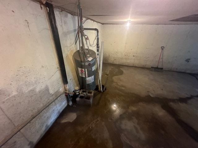 unfinished basement with electric water heater