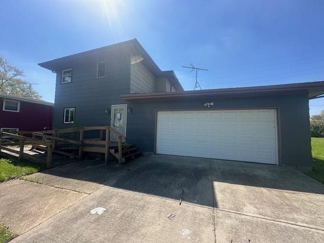view of front of home with driveway and an attached garage