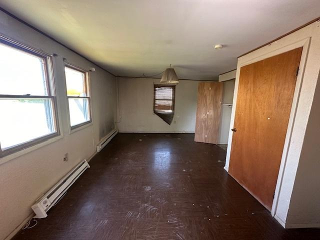 spare room featuring a baseboard radiator