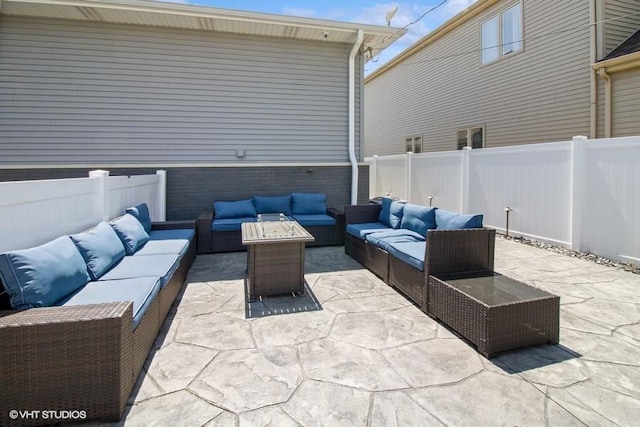 view of patio with outdoor lounge area and a fenced backyard