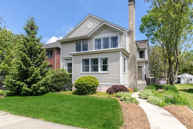 427 Leonard St, Park Ridge, IL 60068 - traditional-style home with a front yard and a chimney