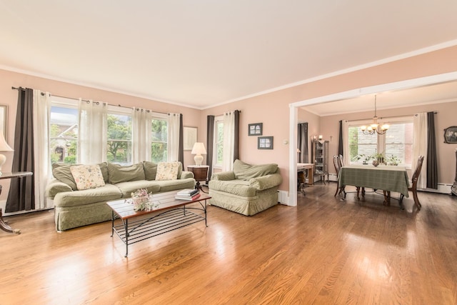 427 Leonard St, Park Ridge, IL 60068 - living area featuring a chandelier, plenty of natural light, ornamental molding, wood finished floors, and baseboards