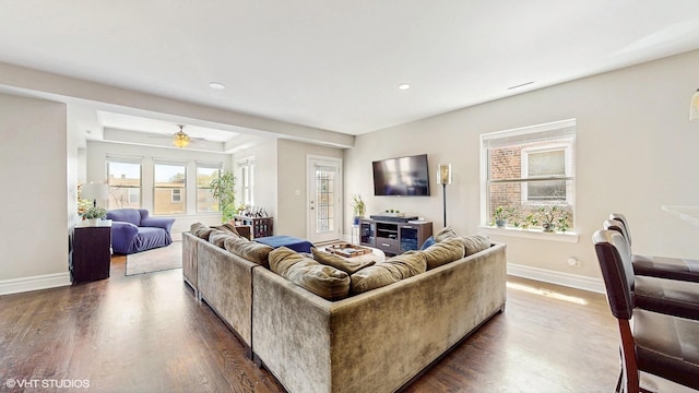 living area with dark wood finished floors, baseboards, recessed lighting, and a ceiling fan