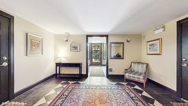 tiled entryway with baseboards