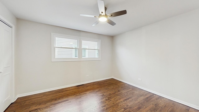 3524 N Natoma Ave, Chicago, IL 60634 - unfurnished bedroom with dark wood finished floors, a closet, baseboards, and ceiling fan