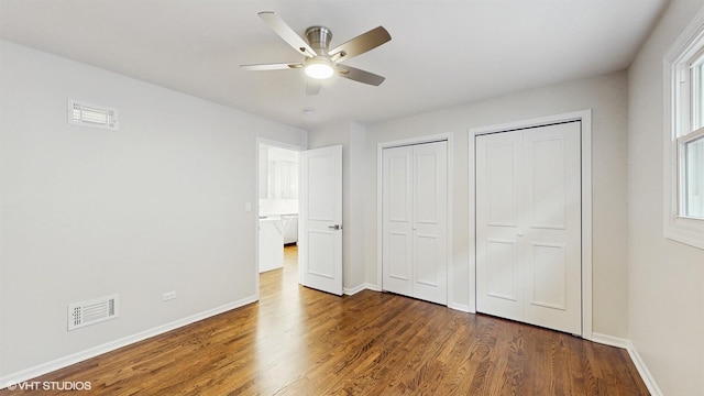 3524 N Natoma Ave, Chicago, IL 60634 - unfurnished bedroom with multiple closets, wood finished floors, baseboards, and ceiling fan