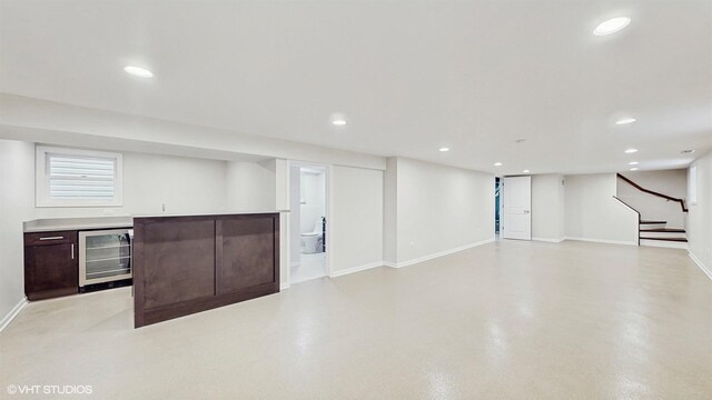 3524 N Natoma Ave, Chicago, IL 60634 - below grade area featuring beverage cooler, bar area, baseboards, stairs, and recessed lighting