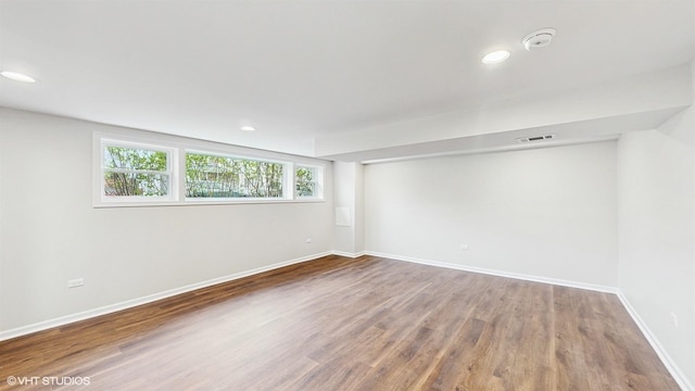 3524 N Natoma Ave, Chicago, IL 60634 - empty room featuring wood finished floors, baseboards, recessed lighting, and a smoke detector