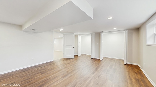 3524 N Natoma Ave, Chicago, IL 60634 - finished below grade area featuring recessed lighting, wood finished floors, and baseboards