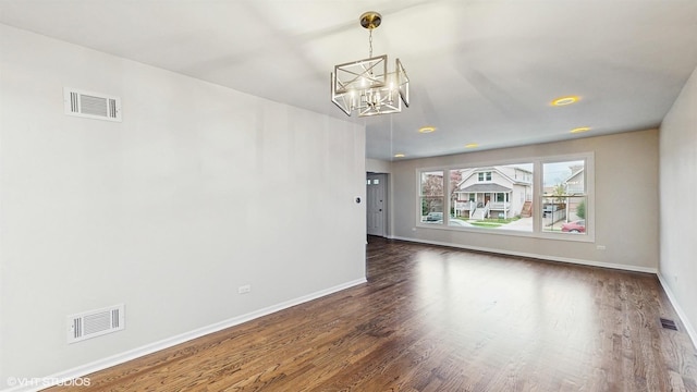 3524 N Natoma Ave, Chicago, IL 60634 - empty room with a chandelier, wood finished floors, and baseboards