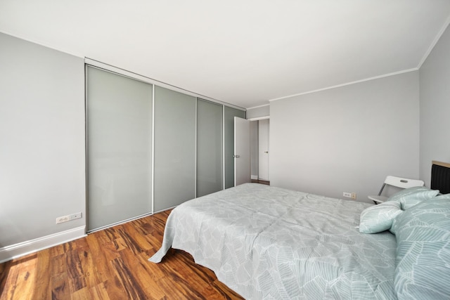 5455 N Sheridan Rd Unit 3804, Chicago, IL 60640 - bedroom with ornamental molding, a closet, and wood finished floors