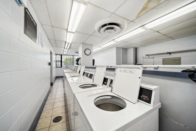 5455 N Sheridan Rd Unit 3804, Chicago, IL 60640 - community laundry room with washing machine and clothes dryer and light tile patterned flooring