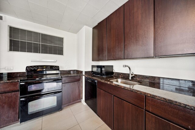 5455 N Sheridan Rd Unit 3804, Chicago, IL 60640 - kitchen featuring black appliances, a sink, dark stone counters, dark brown cabinetry, and light tile patterned floors