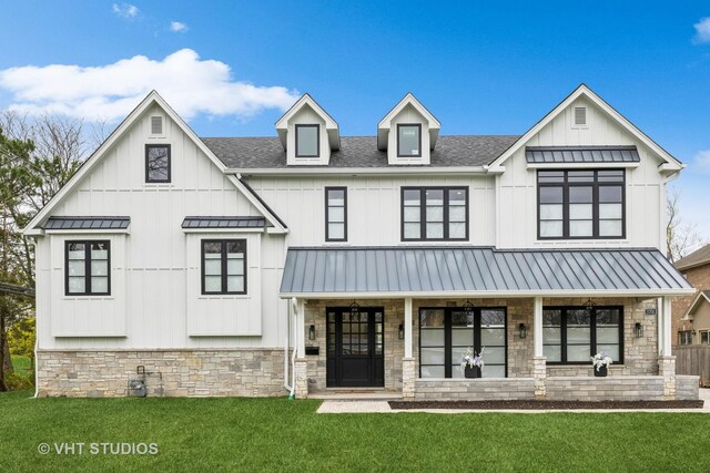 3701 Knollwood Ln, Glenview, IL 60025 - view of front of home with stone siding, a front lawn, and board and batten siding