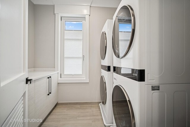 3701 Knollwood Ln, Glenview, IL 60025 - laundry area featuring stacked washer and clothes dryer and light wood-type flooring
