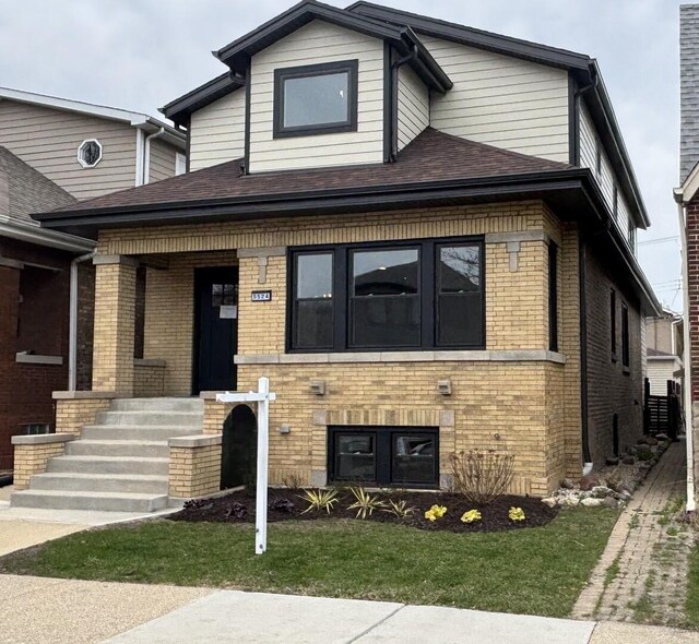 5524 W Byron St, Chicago, IL 60641 - view of front of property featuring brick siding and a front lawn