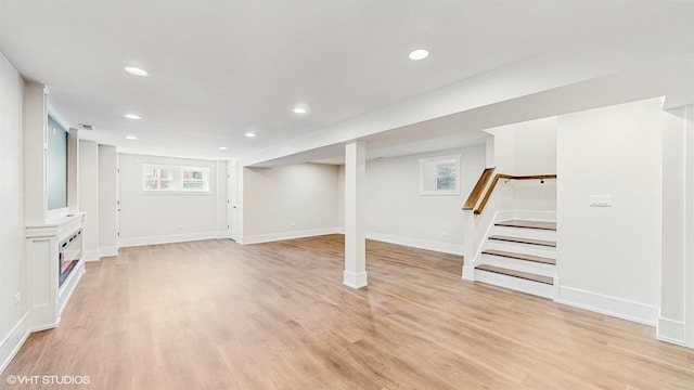 5524 W Byron St, Chicago, IL 60641 - below grade area with stairs, light wood-style flooring, recessed lighting, and baseboards