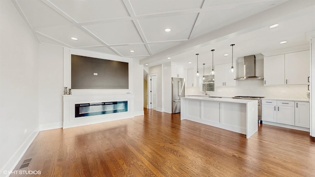 5524 W Byron St, Chicago, IL 60641 - kitchen with wall chimney exhaust hood, appliances with stainless steel finishes, recessed lighting, coffered ceiling, and white cabinetry