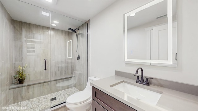 5524 W Byron St, Chicago, IL 60641 - bathroom with toilet, vanity, a shower stall, and recessed lighting