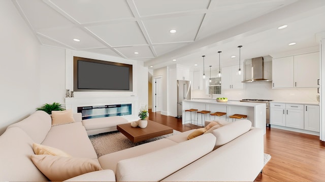5524 W Byron St, Chicago, IL 60641 - living area featuring recessed lighting, light wood-style flooring, coffered ceiling, and a glass covered fireplace