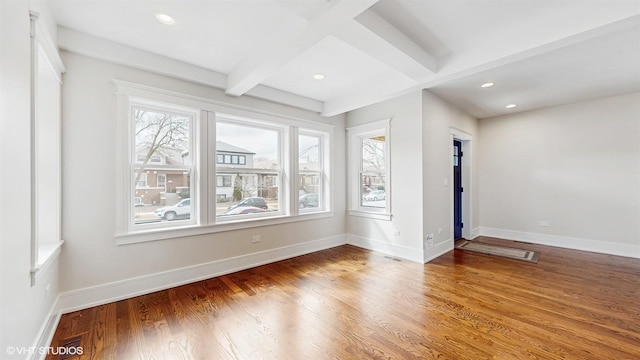 5524 W Byron St, Chicago, IL 60641 - spare room featuring wood finished floors, beam ceiling, baseboards, and recessed lighting
