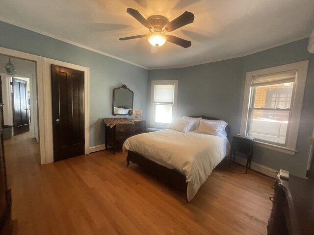 6108 N Maplewood Ave, Chicago, IL 60659 - bedroom featuring wood finished floors, crown molding, baseboards, and a ceiling fan