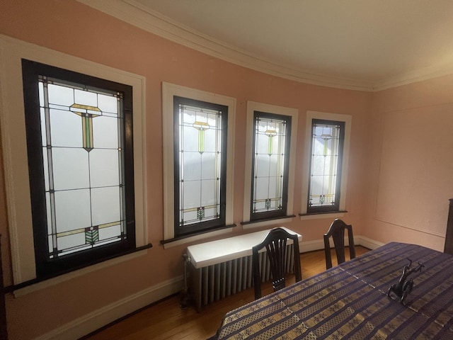 6108 N Maplewood Ave, Chicago, IL 60659 - dining space featuring ornamental molding, baseboards, and wood finished floors