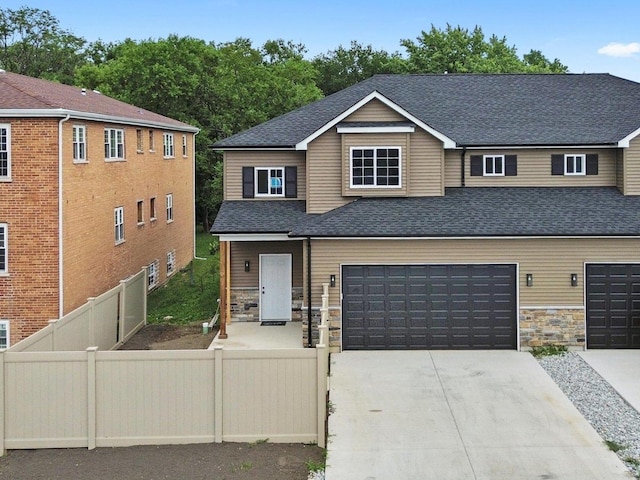 13723 S Springfield Ave, Robbins, IL 60472 - view of front of property with concrete driveway, stone siding, roof with shingles, and a garage