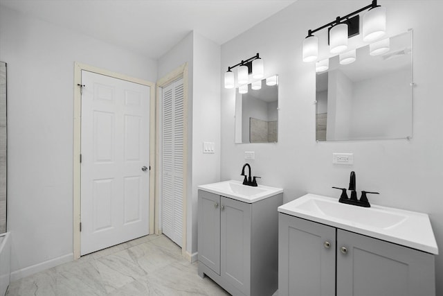 13723 S Springfield Ave, Robbins, IL 60472 - bathroom featuring a closet, marble look tiles, and two vanities