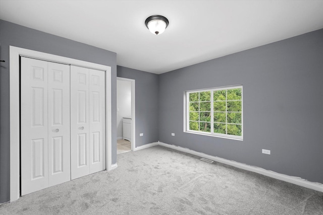 13723 S Springfield Ave, Robbins, IL 60472 - unfurnished bedroom with carpet floors and a closet