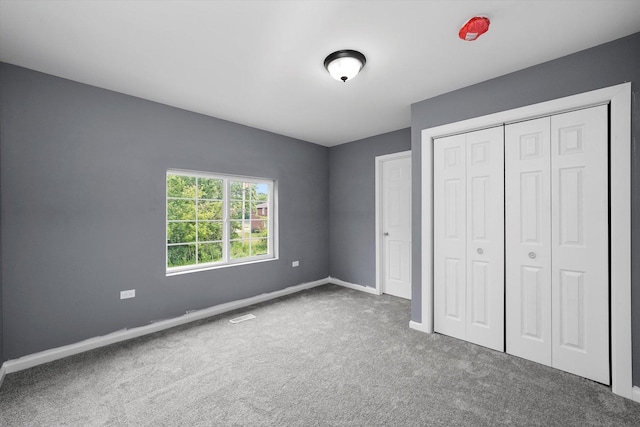 13723 S Springfield Ave, Robbins, IL 60472 - unfurnished bedroom featuring carpet and a closet