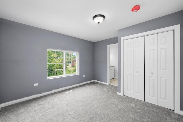 13723 S Springfield Ave, Robbins, IL 60472 - unfurnished bedroom with carpet floors and a closet