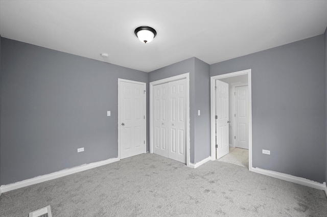 13723 S Springfield Ave, Robbins, IL 60472 - unfurnished bedroom with carpet flooring and a closet