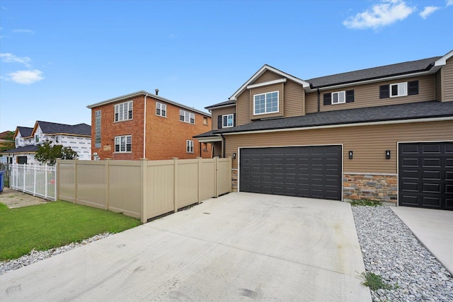 13723 S Springfield Ave, Robbins, IL 60472 - view of front of property with concrete driveway, an attached garage, and stone siding