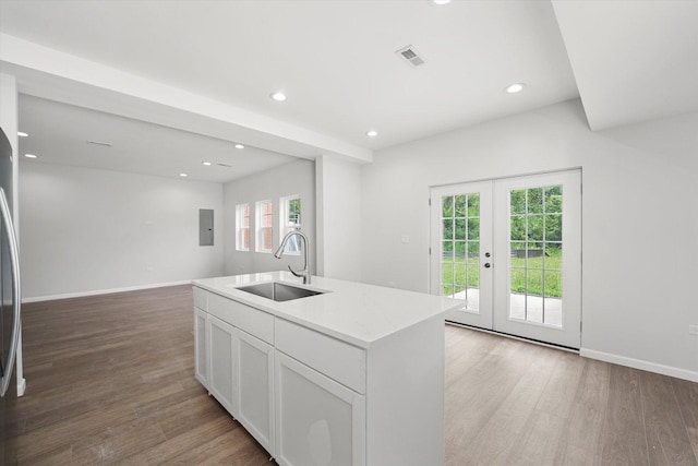 13723 S Springfield Ave, Robbins, IL 60472 - kitchen with wood finished floors, healthy amount of natural light, recessed lighting, and a center island with sink