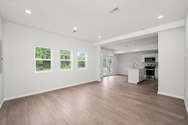 13723 S Springfield Ave, Robbins, IL 60472 - unfurnished living room featuring wood finished floors and recessed lighting