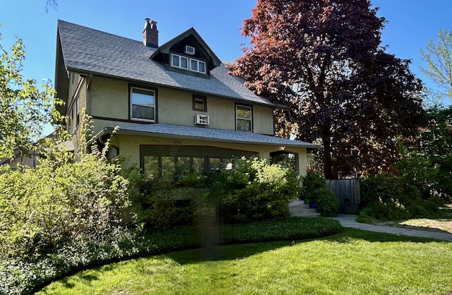 1304 Wesley Ave, Evanston, IL 60201 - american foursquare style home with a chimney, a front yard, stucco siding, and a shingled roof