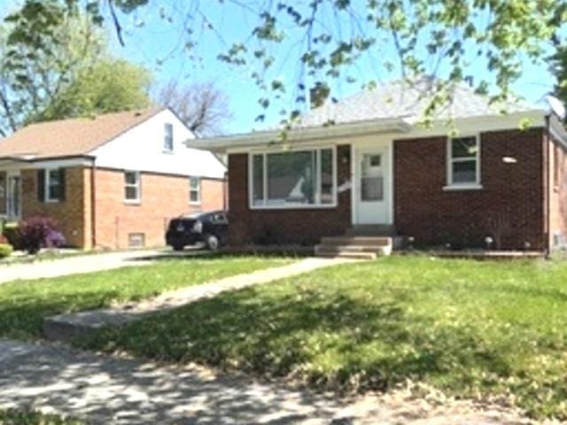 17545 Burnham Ave, Lansing, IL 60438 - view of front of home featuring brick siding, a front lawn, and entry steps