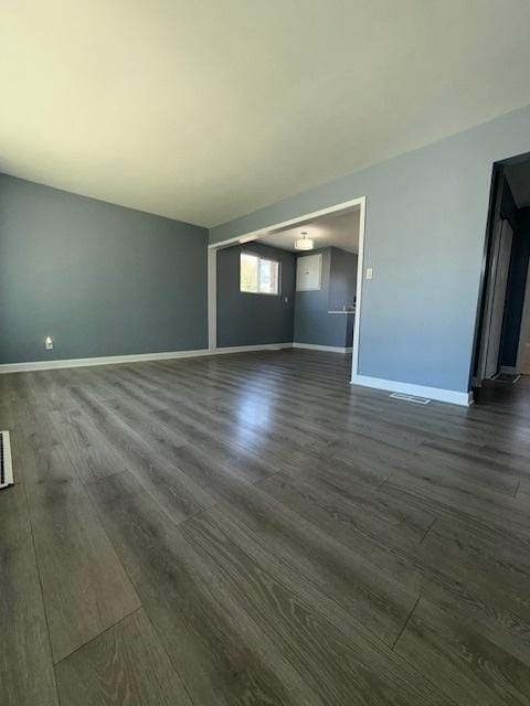 17545 Burnham Ave, Lansing, IL 60438 - unfurnished living room featuring dark wood finished floors and baseboards