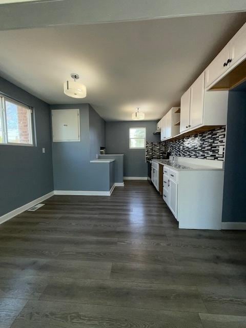 17545 Burnham Ave, Lansing, IL 60438 - kitchen featuring baseboards, white cabinets, open shelves, dark wood-type flooring, and backsplash