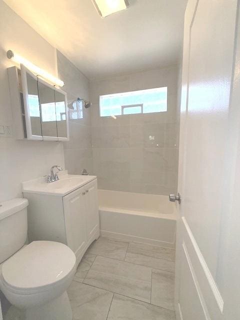 17545 Burnham Ave, Lansing, IL 60438 - bathroom featuring toilet, vanity, washtub / shower combination, and marble look tile flooring