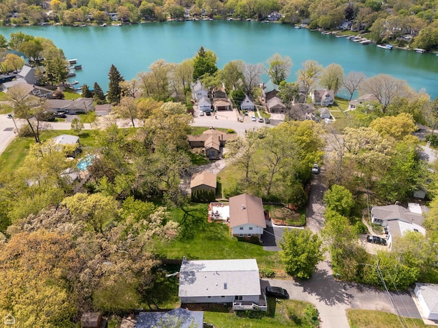 aerial view of residential area featuring a nearby body of water