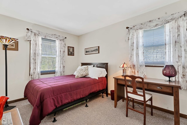 bedroom featuring carpet flooring and baseboards