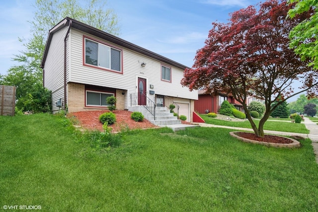 20054 Orchard Ave, Lynwood, IL 60411 - bi-level home with an attached garage, a front lawn, and brick siding