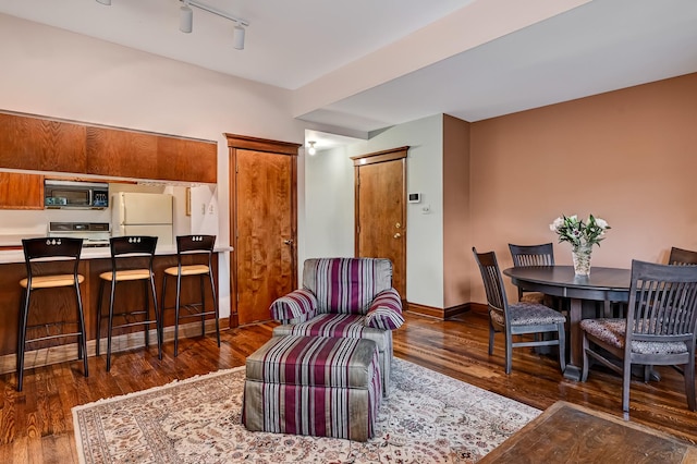 1050 W Buena Ave Unit 1A, Chicago, IL 60613 - dining room with wood finished floors, track lighting, and baseboards
