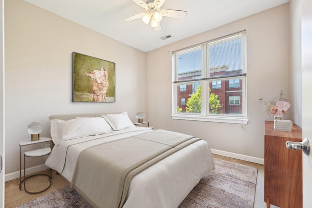 bedroom with baseboards and ceiling fan