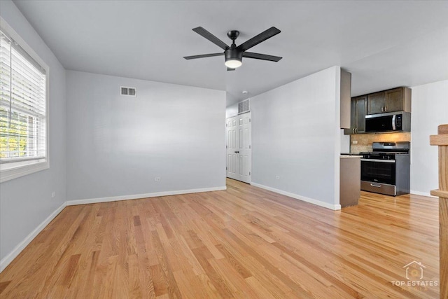 642 Gray Ct Unit 0, Wheeling, IL 60090 - unfurnished living room with light wood-style floors, a ceiling fan, and baseboards