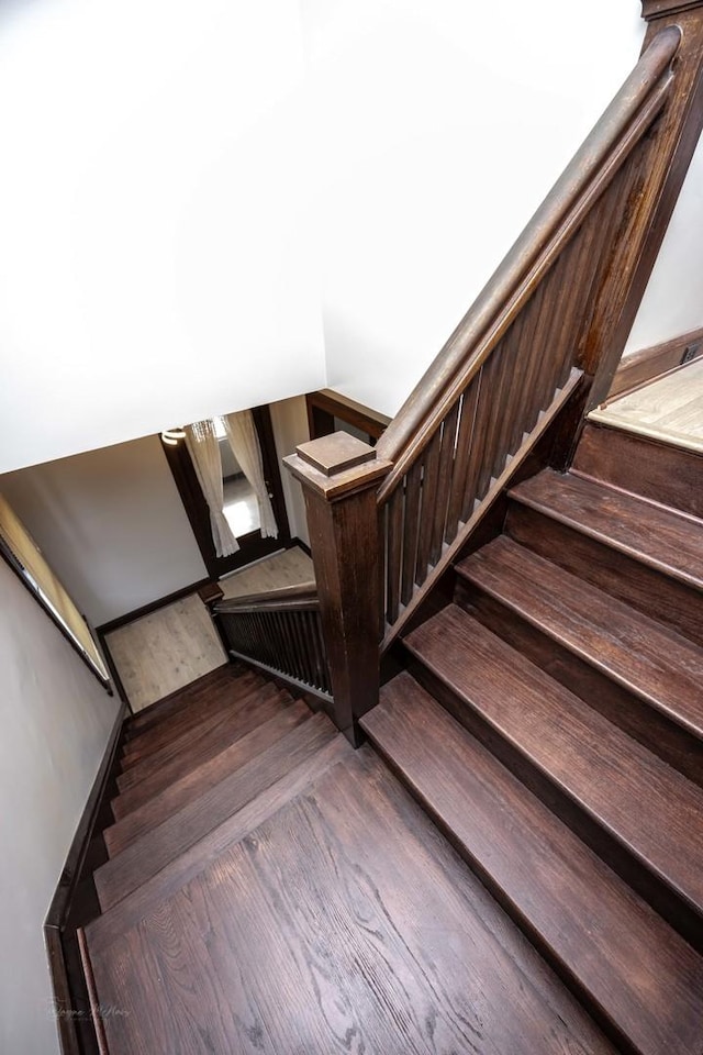 stairway with wood finished floors