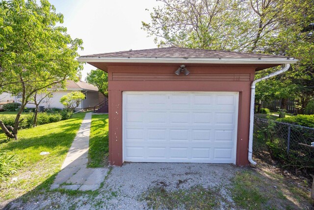 detached garage featuring driveway